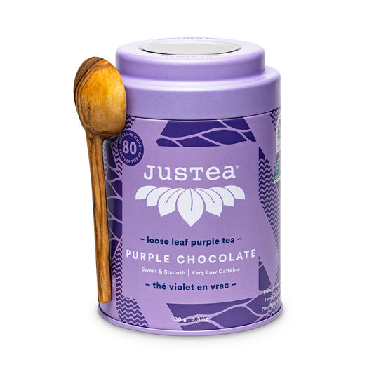JusTea PURPLE CHOCOLATE Loose Purple Tea, 40+ Cup Tin + Spoon, 1/5 Caffeine | Fair-Trade PURPLE CHOCOLATE Loose Leaf Purple Tea. 100g/3.5oz Tin with a Hand-Carved Tea Spoon. 1/5 Caffeine. Organic.