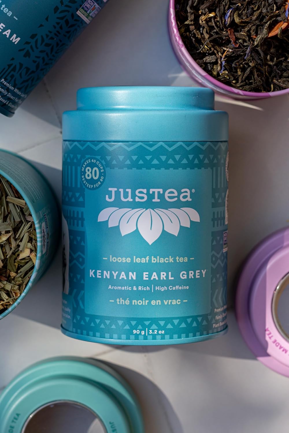 JusTea KENYAN EARL GREY Loose Black Tea, 40+ Cups Tin + Spoon, 4/5 Caffeine | Fair-Trade KENYAN EARL GREY Loose Leaf Black Tea. 90g/3.2oz Reusable Tin with a Hand-Carved Tea Spoon. 4/5 Caffeine. Organic.