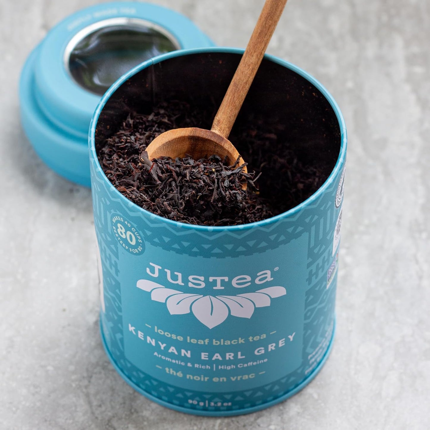 JusTea KENYAN EARL GREY Loose Black Tea, 40+ Cups Tin + Spoon, 4/5 Caffeine | Fair-Trade KENYAN EARL GREY Loose Leaf Black Tea. 90g/3.2oz Reusable Tin with a Hand-Carved Tea Spoon. 4/5 Caffeine. Organic.